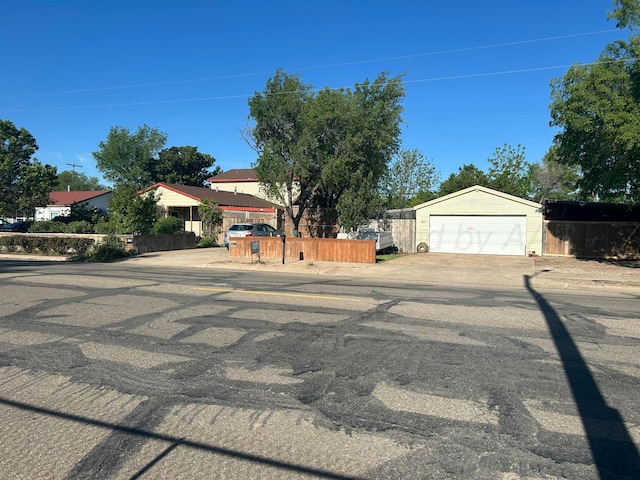1026 S Eastern St, Amarillo, TX 79104 - view of front facade with an outdoor structure, concrete driveway, and fence
