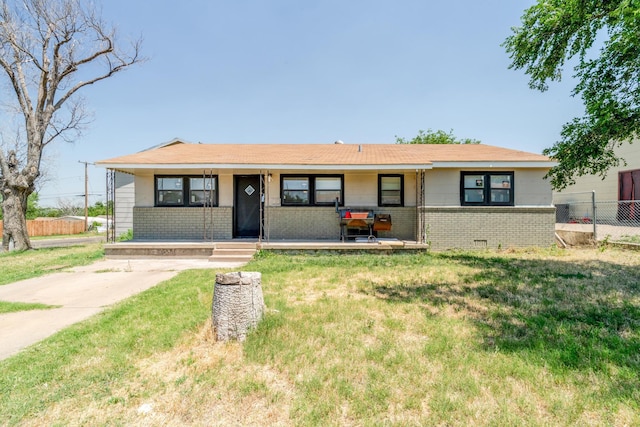 2738 Palm St, Amarillo, TX 79107 - single story home with brick siding and a porch