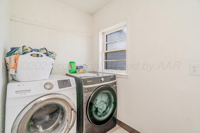 2738 Palm St, Amarillo, TX 79107 - laundry room featuring washer and dryer and wood finished floors