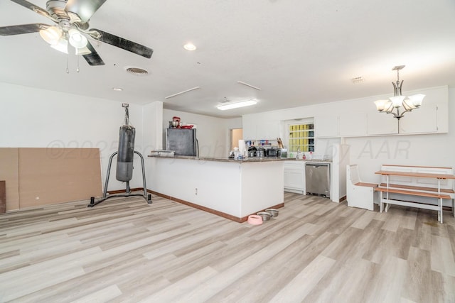 2738 Palm St, Amarillo, TX 79107 - kitchen featuring appliances with stainless steel finishes, light wood-type flooring, a peninsula, white cabinetry, and recessed lighting