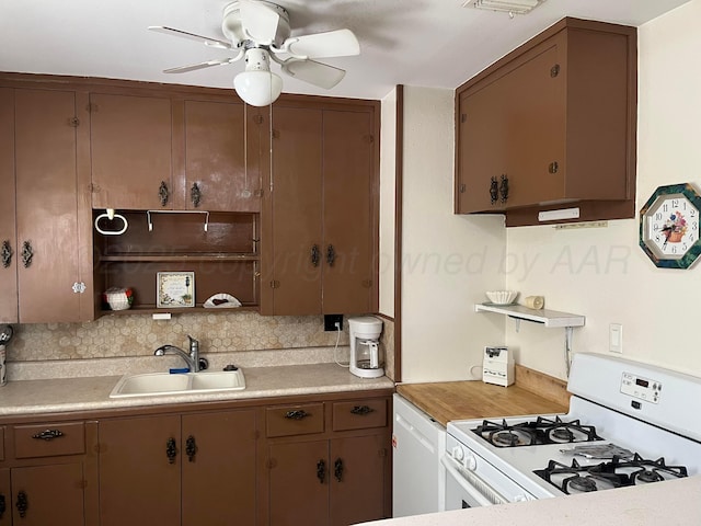 905 Harrington St, Borger, TX 79007 - kitchen with white appliances, a ceiling fan, tasteful backsplash, light countertops, and open shelves