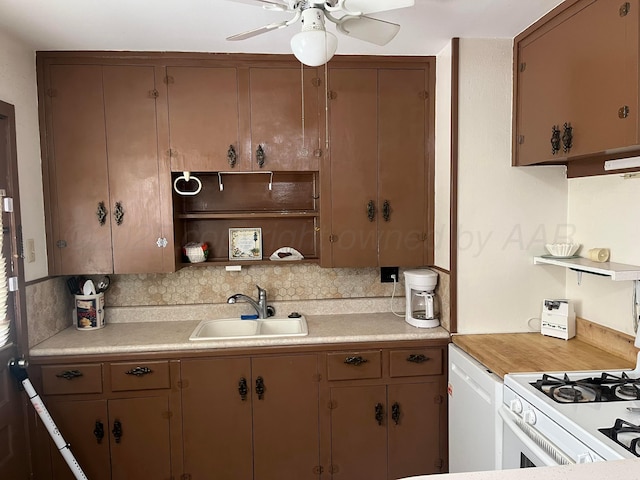 905 Harrington St, Borger, TX 79007 - kitchen with a ceiling fan, light countertops, tasteful backsplash, open shelves, and gas range gas stove