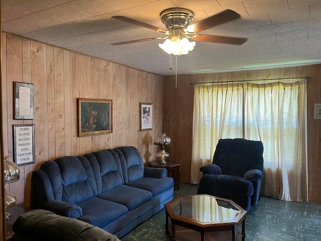 905 Harrington St, Borger, TX 79007 - living area featuring wooden walls and a ceiling fan
