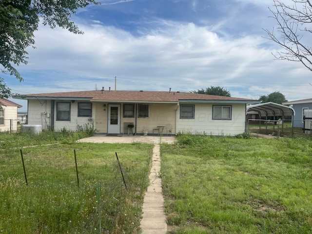 905 Harrington St, Borger, TX 79007 - rear view of house featuring a detached carport and a patio area