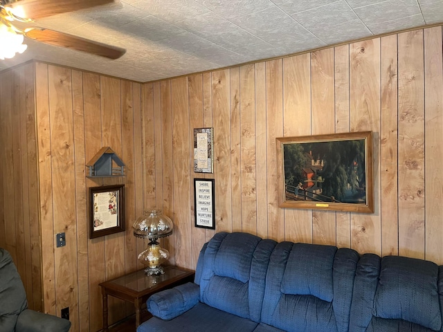 905 Harrington St, Borger, TX 79007 - living room featuring ceiling fan and wooden walls