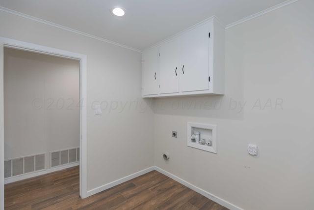 washroom featuring cabinets, dark hardwood / wood-style floors, hookup for a washing machine, and ornamental molding