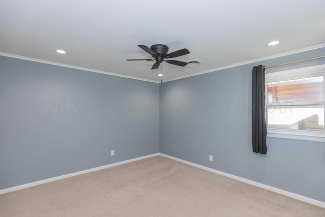 carpeted empty room with ornamental molding and ceiling fan