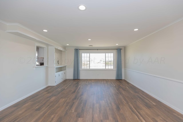 unfurnished living room with dark hardwood / wood-style flooring and ornamental molding