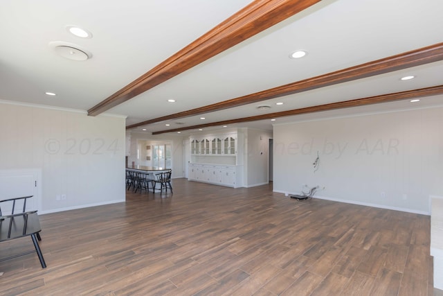 living room with dark hardwood / wood-style flooring, beamed ceiling, and crown molding