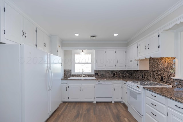 kitchen featuring white cabinetry, sink, white appliances, and dark stone countertops