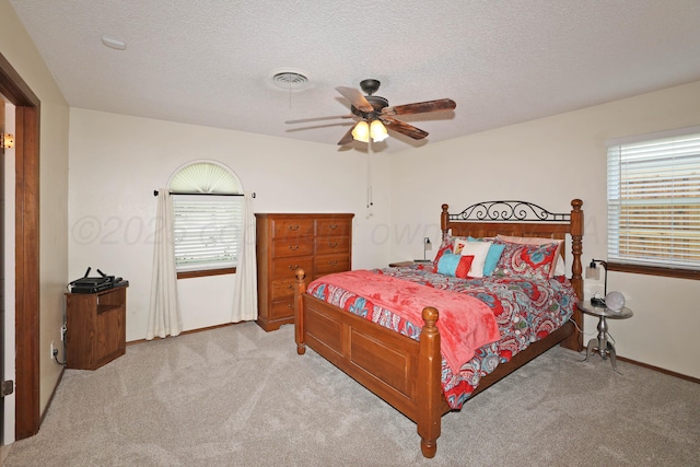 2904 Pittsburg St, Amarillo, TX 79103 - bedroom featuring carpet, a textured ceiling, and a ceiling fan