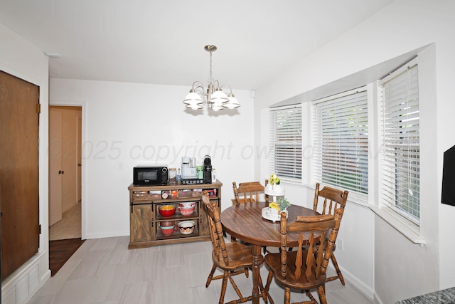 2904 Pittsburg St, Amarillo, TX 79103 - dining space with a chandelier and baseboards