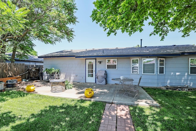 2904 Pittsburg St, Amarillo, TX 79103 - rear view of property with a patio area, an outdoor fire pit, and a shingled roof