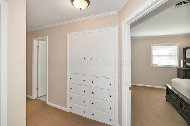interior space featuring crown molding and light colored carpet