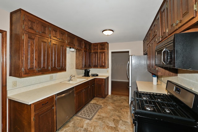 kitchen featuring sink and black appliances