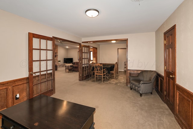living room featuring carpet and french doors