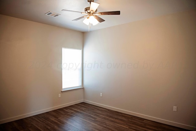 unfurnished room with dark wood-type flooring and ceiling fan