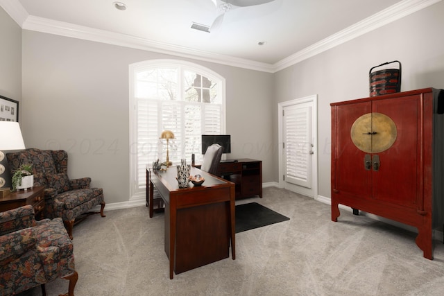 carpeted office with crown molding and ceiling fan