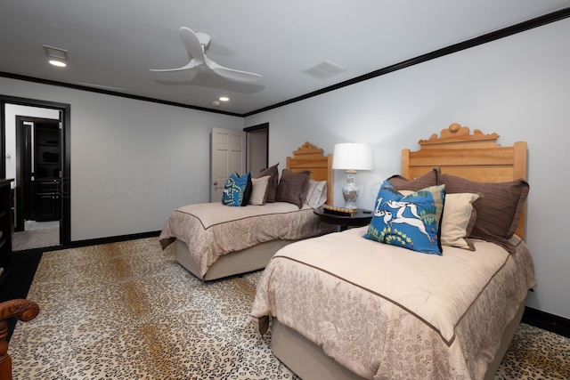 carpeted bedroom with ceiling fan and ornamental molding