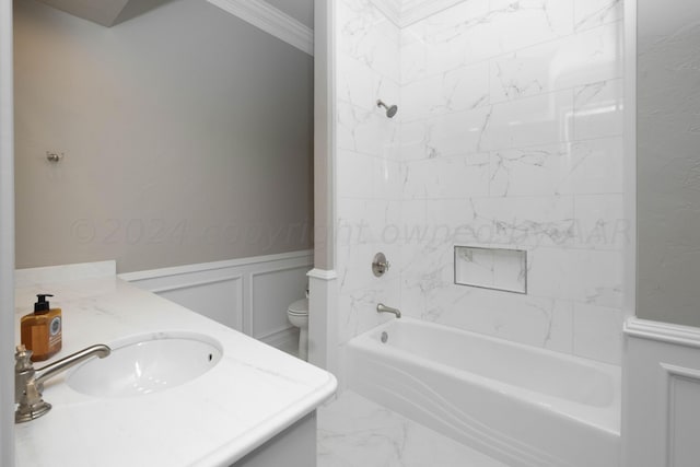 full bathroom with vanity, toilet, tiled shower / bath, and ornamental molding