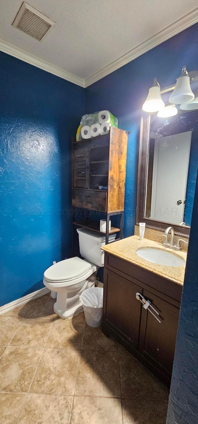 bathroom featuring crown molding, tile patterned floors, vanity, and toilet