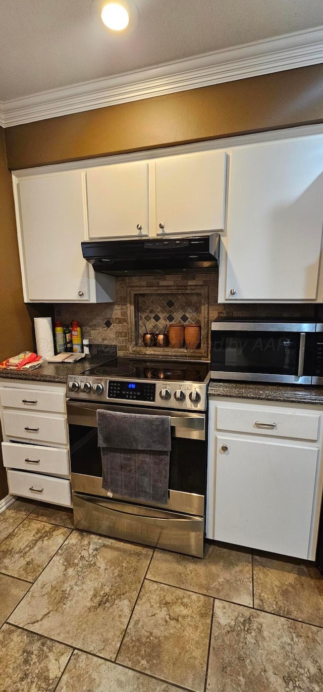 kitchen featuring crown molding, stainless steel appliances, and white cabinets