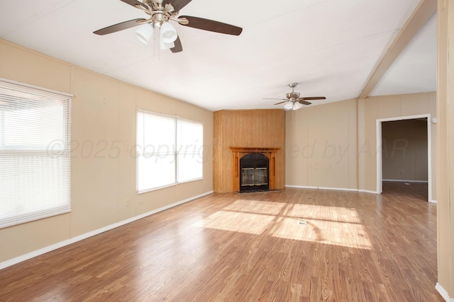 unfurnished living room with a ceiling fan, light wood-style flooring, a fireplace with flush hearth, and baseboards