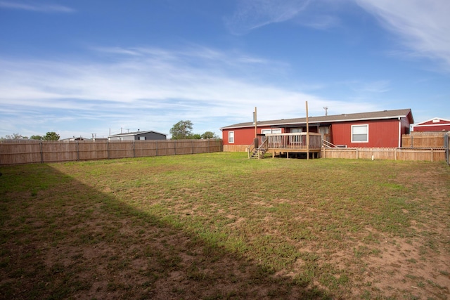 view of yard featuring a deck and stairway