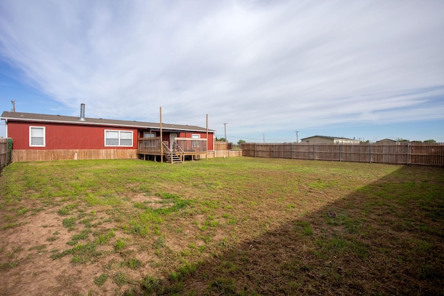 view of yard featuring a wooden deck