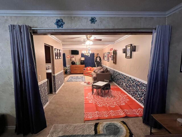 1400 16th St, Hereford, TX 79045 - cinema with ornamental molding, carpet floors, a ceiling fan, and wainscoting