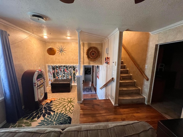 1400 16th St, Hereford, TX 79045 - living room featuring crown molding, wood finished floors, stairway, and a textured ceiling