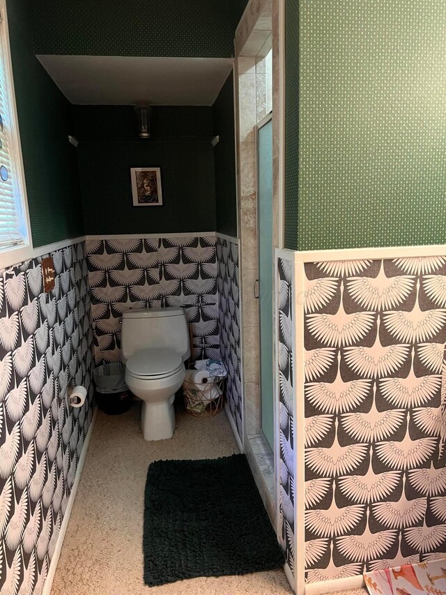 1400 16th St, Hereford, TX 79045 - bathroom featuring toilet, a stall shower, and wainscoting