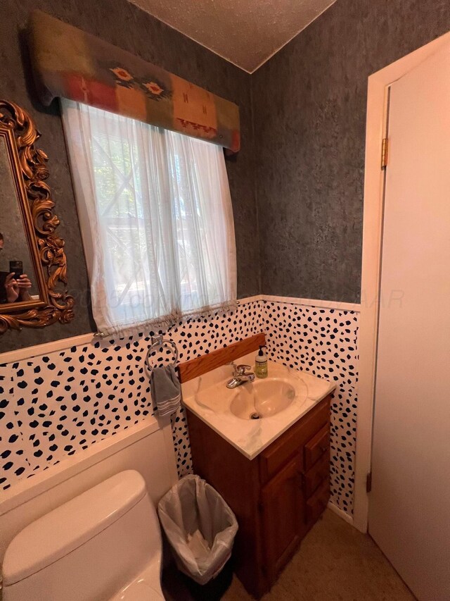 1400 16th St, Hereford, TX 79045 - half bathroom featuring vanity and toilet