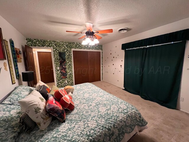 1400 16th St, Hereford, TX 79045 - bedroom featuring carpet flooring, a textured ceiling, and ceiling fan
