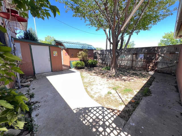 1400 16th St, Hereford, TX 79045 - view of yard with fence, an outbuilding, and a storage shed