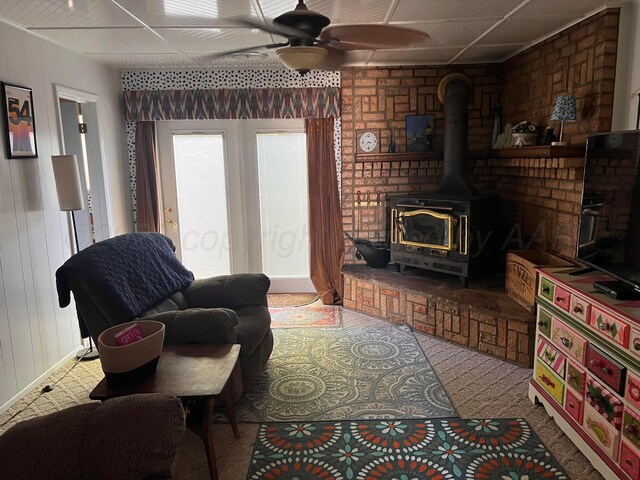 1400 16th St, Hereford, TX 79045 - living room with a wood stove and a ceiling fan