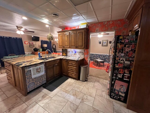1400 16th St, Hereford, TX 79045 - kitchen with a sink, a peninsula, a ceiling fan, light marble finish flooring, and light stone countertops