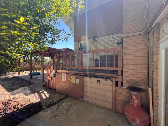 1400 16th St, Hereford, TX 79045 - view of home's exterior featuring brick siding, a patio, and stairway