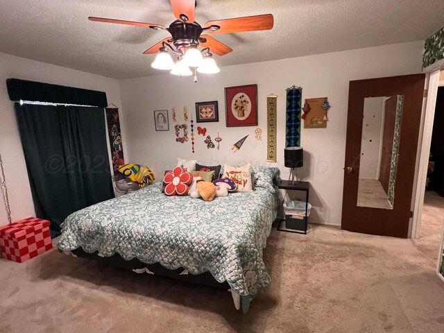 1400 16th St, Hereford, TX 79045 - carpeted bedroom featuring a textured ceiling and a ceiling fan