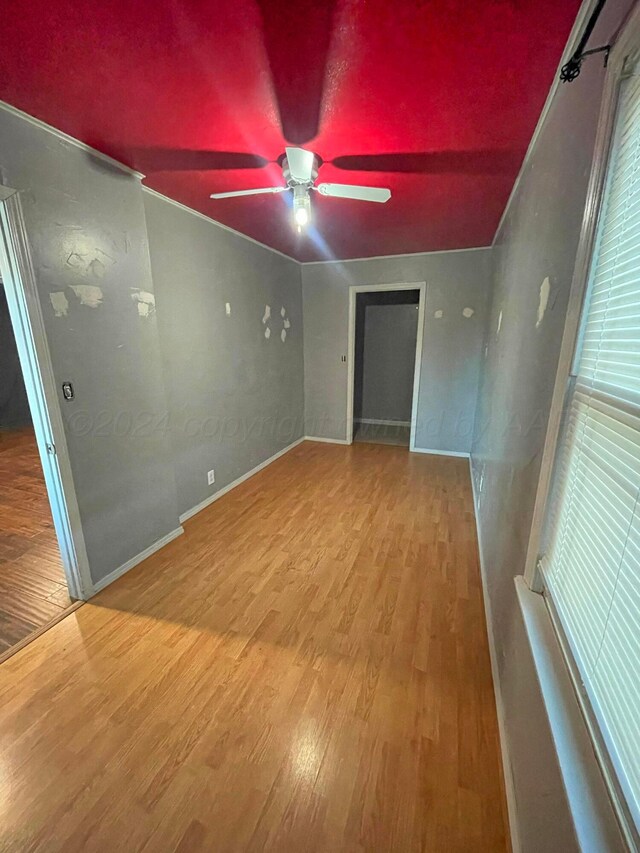 spare room featuring ceiling fan and hardwood / wood-style flooring