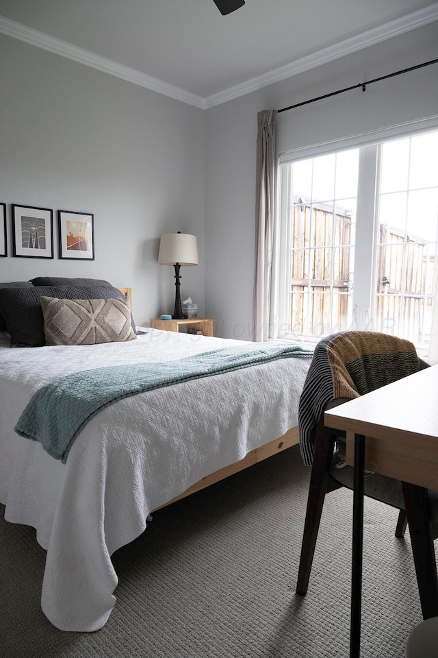 carpeted bedroom featuring ornamental molding