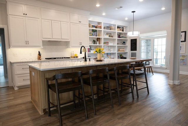 kitchen with open shelves, dark wood-type flooring, white cabinetry, stovetop, and recessed lighting