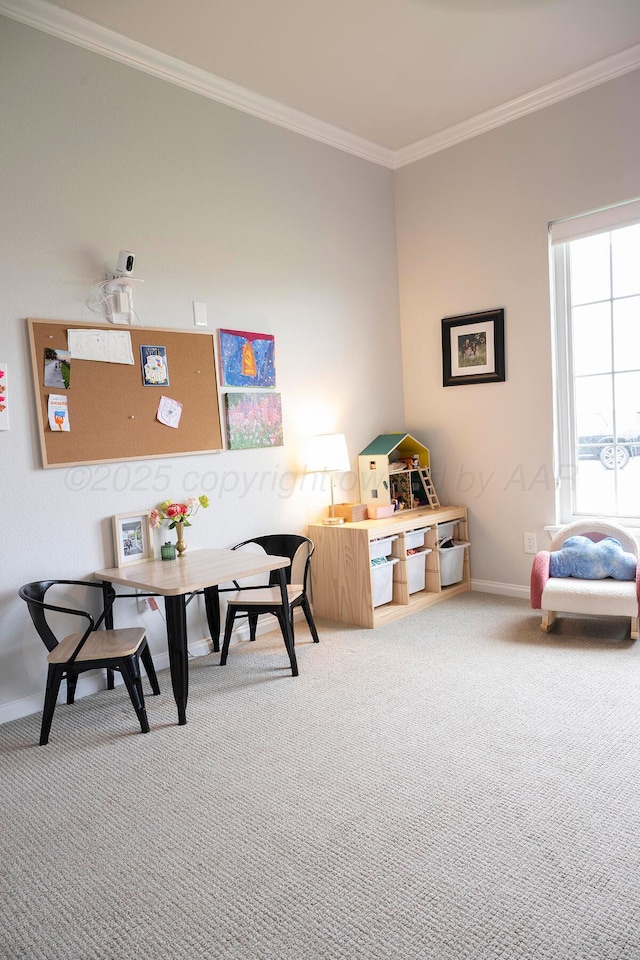 rec room featuring carpet flooring, ornamental molding, and baseboards
