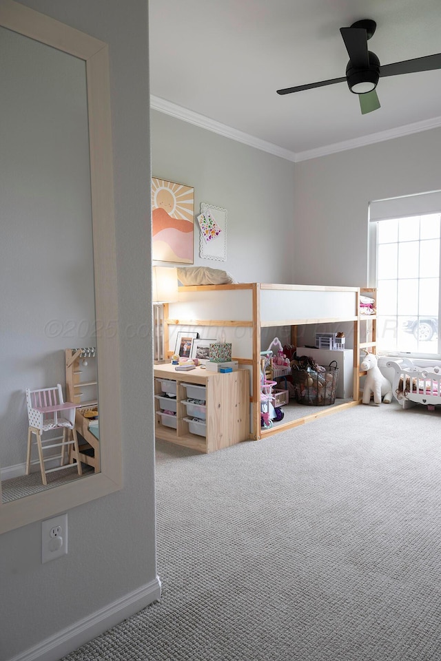 bedroom with carpet, crown molding, baseboards, and ceiling fan