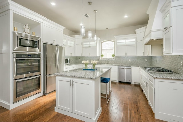 6308 Lauren Ashleigh Dr, Amarillo, TX 79119 - kitchen with stainless steel appliances, white cabinetry, a kitchen island, glass insert cabinets, and recessed lighting