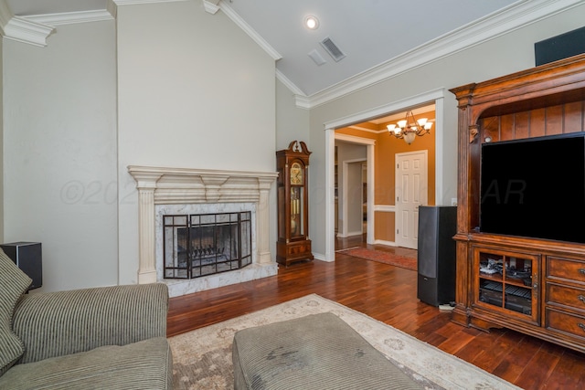3501 Van Winkle Dr, Amarillo, TX 79121 - living area with a chandelier, wood finished floors, crown molding, vaulted ceiling, and a fireplace