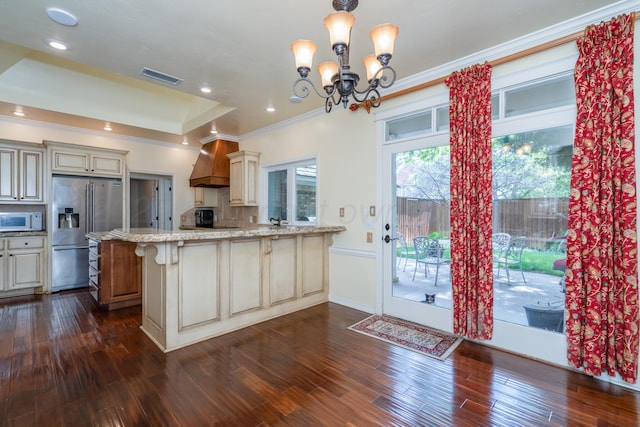 3501 Van Winkle Dr, Amarillo, TX 79121 - kitchen with stainless steel fridge with ice dispenser, white microwave, light stone countertops, a chandelier, and a peninsula