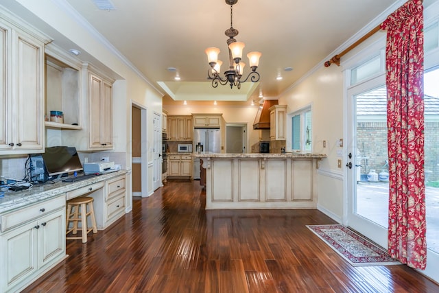 3501 Van Winkle Dr, Amarillo, TX 79121 - kitchen featuring a peninsula, dark wood-style flooring, a chandelier, decorative backsplash, and light stone countertops