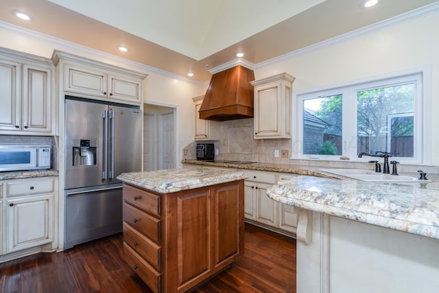 3501 Van Winkle Dr, Amarillo, TX 79121 - kitchen featuring high end fridge, white microwave, a sink, custom range hood, and dark wood-style floors
