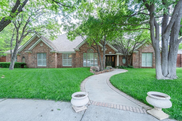 3501 Van Winkle Dr, Amarillo, TX 79121 - view of front of home with a front yard and brick siding